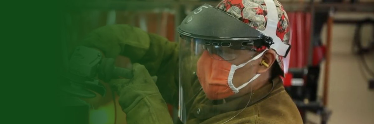 Man wearing mask welding