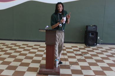 Youth Reynaldo W. joyfully reads his poetry