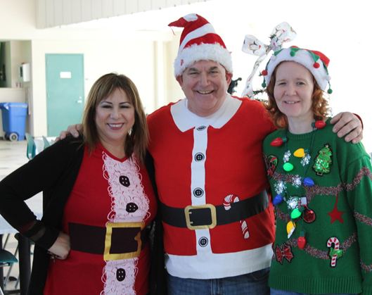 Kenny decks the hall with Asst. Superintendent Jenny Dillon, (left) and DJJ Director Heather Bowlds