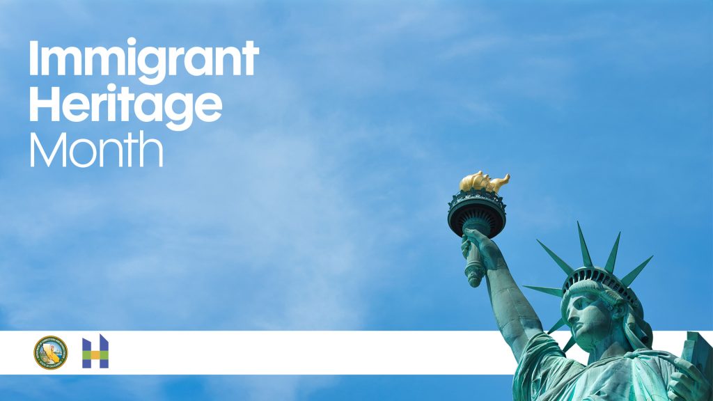 Immigrant heritage month with blue sky on background and statue of liberty in foreground