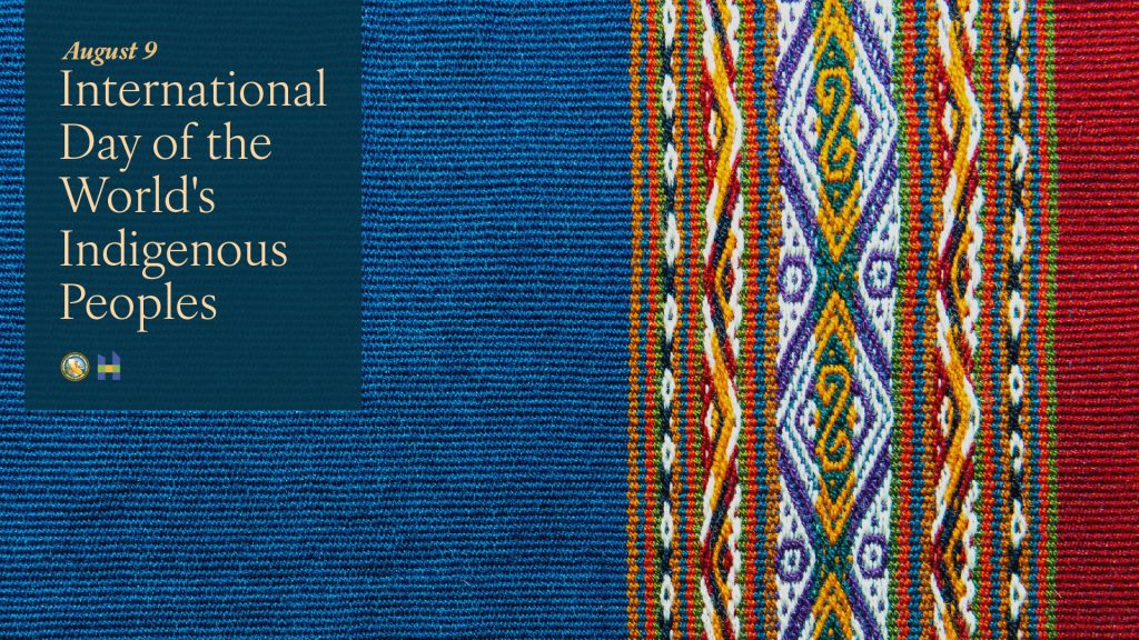 August 9 International Day of the World's Indigenous Peoples on multicolored embroidered background.