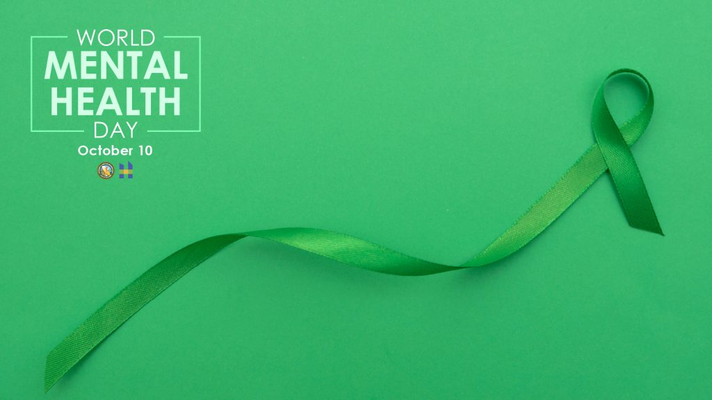 World Mental Health Day October 10 on Green background with green ribbon