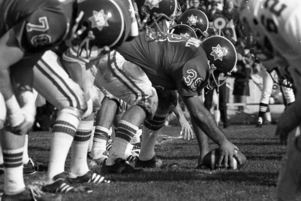 Players on the field at the Pig Bowl.