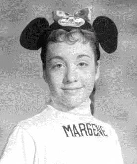 Girl wearing Mickey Mouse ears with name "Margene" on her shirt.