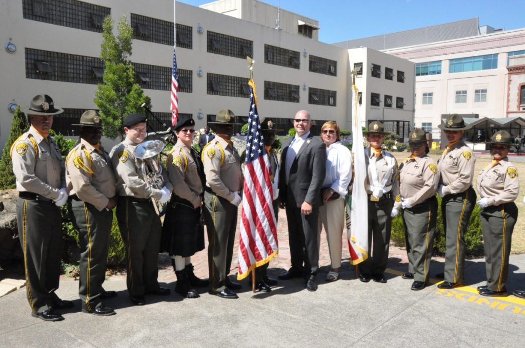 Staff and the warden at San Quentin for the Burchfield memorial 30-year anniversary.