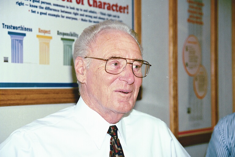 Director Terhune wearing glasses and a tie.