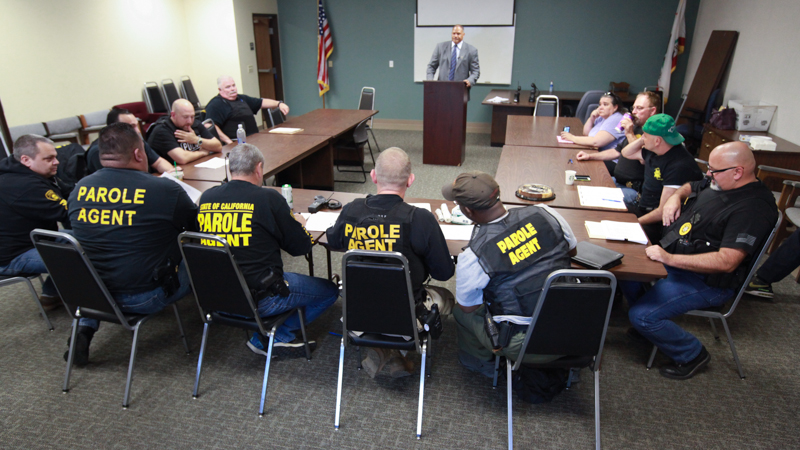 Parole agents are briefed during Operation Boo 2015.