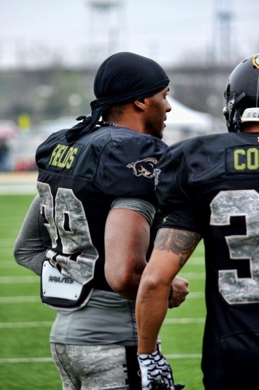 Law enforcement personnel play a charity football game. 