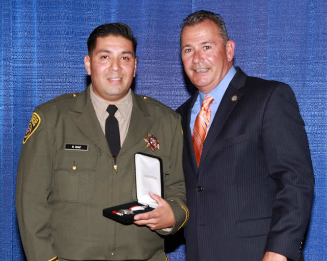 Secretary with Officer Rafael Diaz, Silver Star recipient.