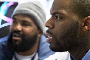 Close-up of two men looking at something off-screen.