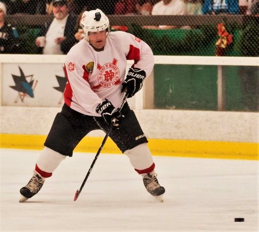 A CMF correctional officer plays hockey for charity.