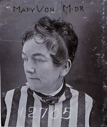 Grainy mugshot of Mary Von, 12705, with her name and letters "MDR".