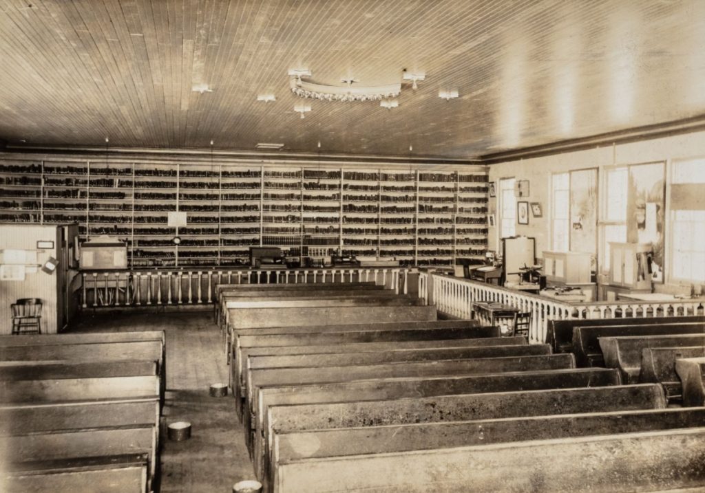 San Quentin library and book bindery in the chapel at San Quentin, 1910.