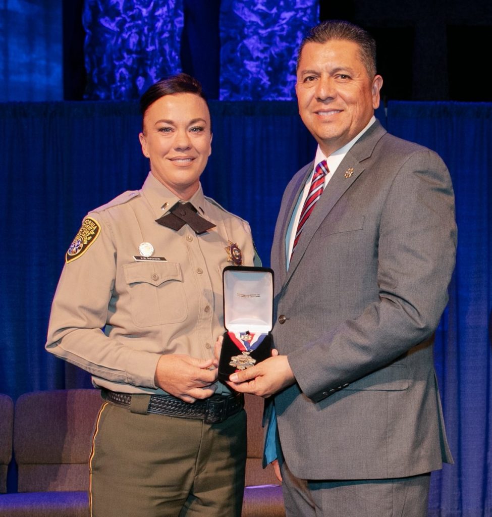 Lt. Kelli Madsen and Secretary Ralph Diaz at 2018 Medal of Valor ceremony.