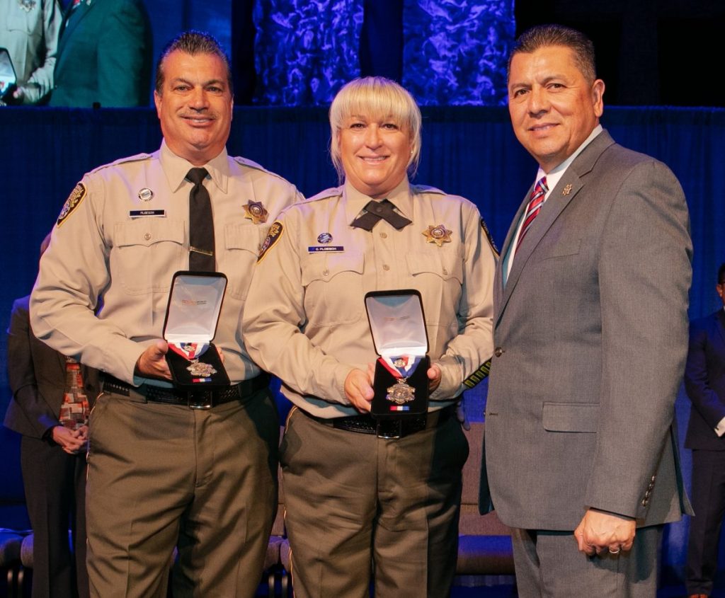 Keith and Catherine Ploesch, Chuckawalla Valley State Prison correctional officers, with the CDCR Secretary at the 2018 Medal of Valor ceremony.