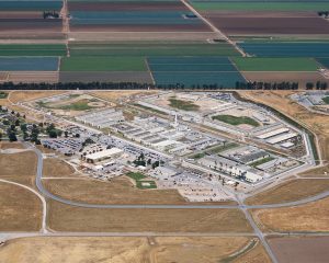 Arial shot of prison surrounded by agricultural land.