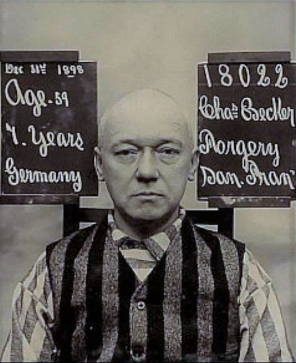 Man in prison stripes. Two boards read: Dec. 31st 1898, Age 59, 7 years, Germany, 18022, Chas Becker, Forgery, San Fran.