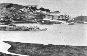 Photo of prison across water with words "San Quentin" at the bottom.