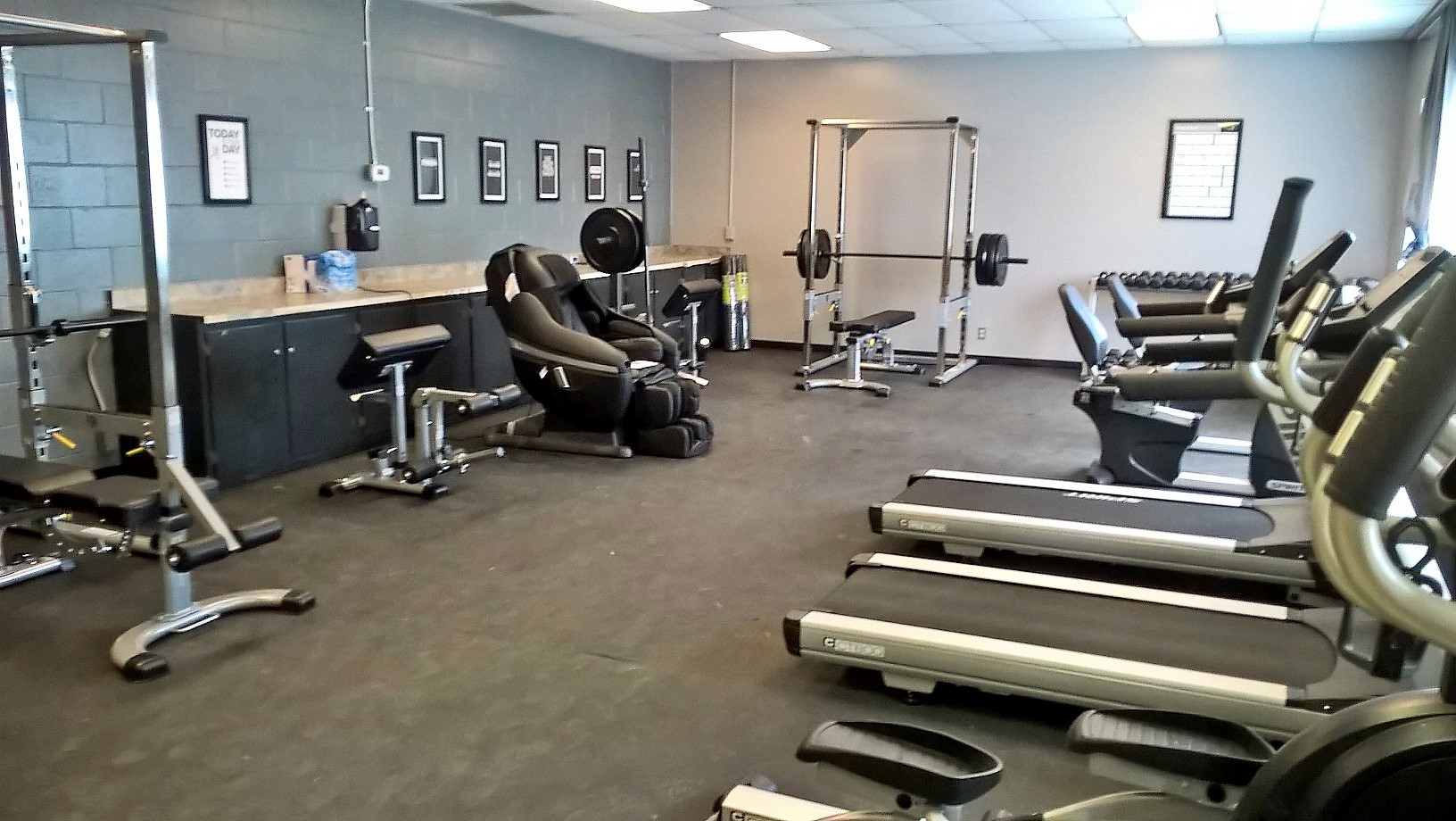 Exercise equipment in a large room.