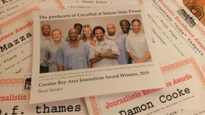 Photo of inmates printed on an awards certificate.