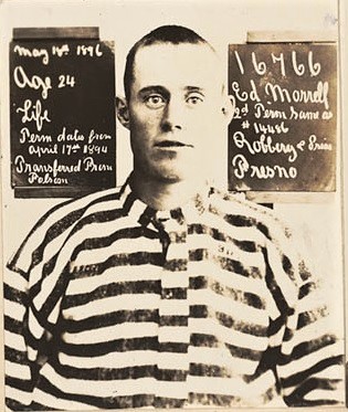 Old photo of Ed Morrell wearing stripped inmate uniform