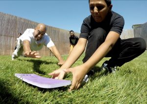 Man slides into home base.