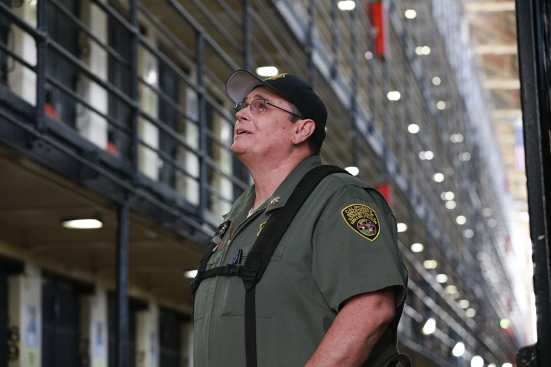 Correctional officer stands on death row at San Quentin.
