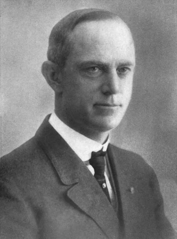 Portrait of man in tie and jacket.