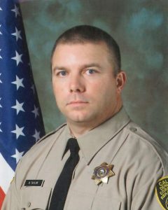 Rory Taylor wearing correctional officer uniform.