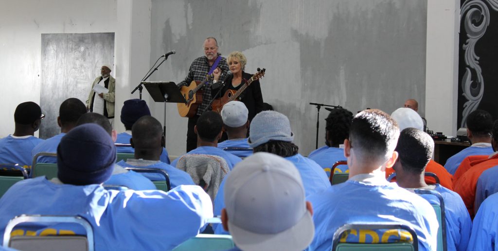 Arts in Corrections perform for inmates during the Day of Peace and Reconciliation at High Desert State Prison.