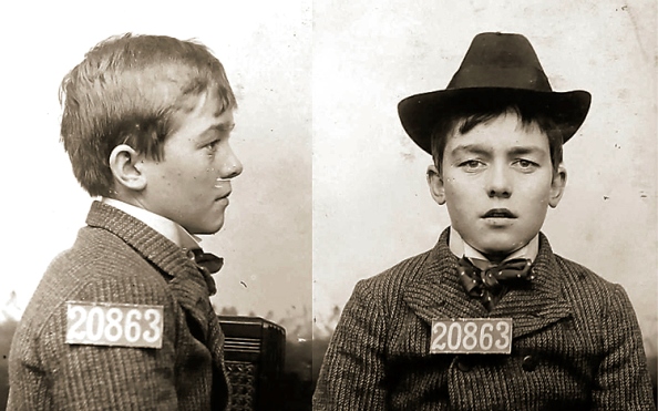 Young teen boy mugshot with numbers 20863.