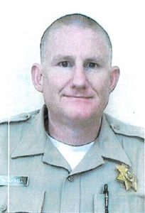 Man in correctional officer uniform.