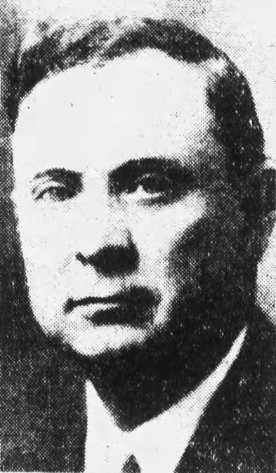 grainy newspaper photo of a man wearing a tie.