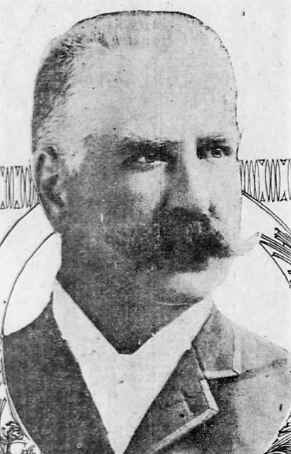 Newspaper photo of man with mustache.