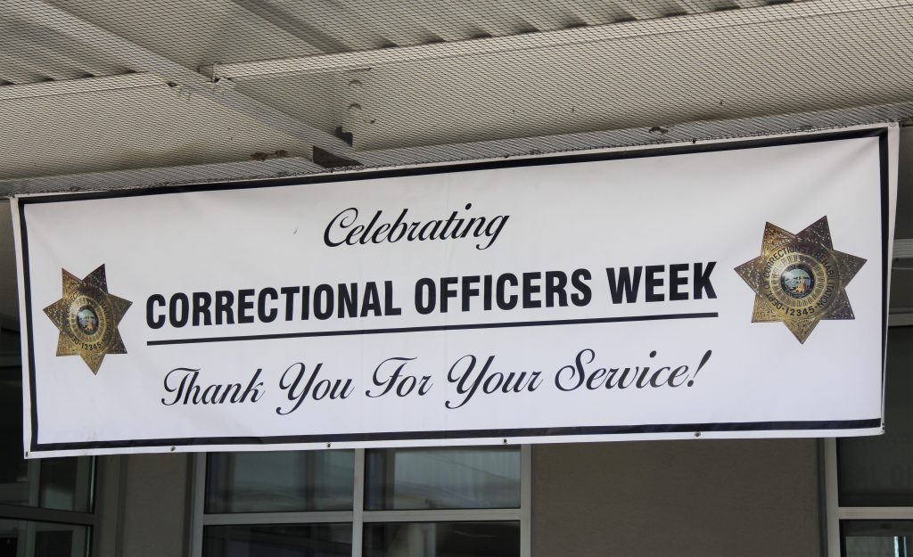 Banner says celebrating correctional officers week. Thank you for your service.