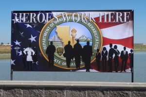 Heroes work here sign with the CDCR logo and an American flag.