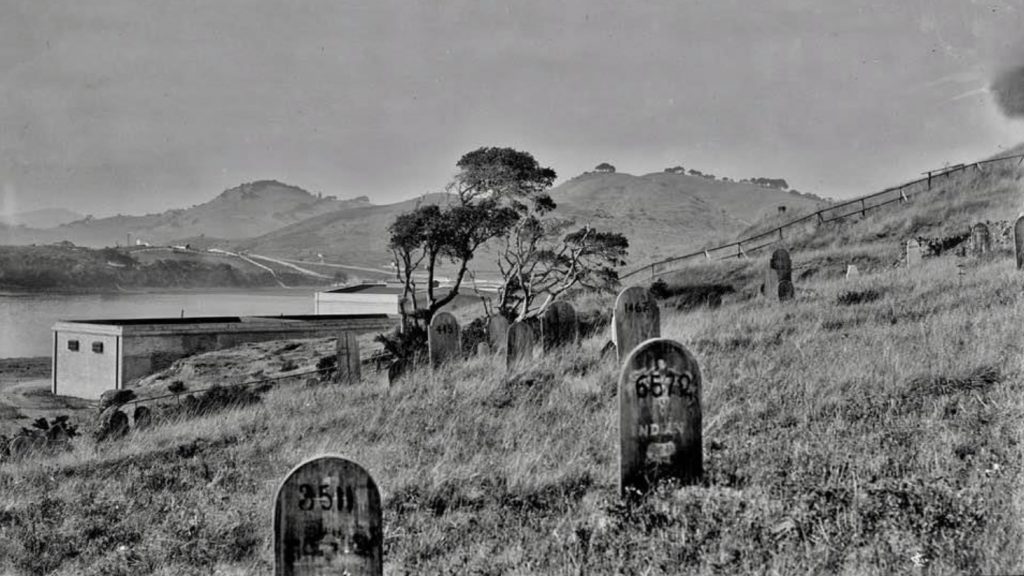 A prison cemetery with gravemarkers.