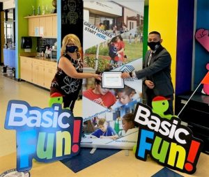 CIW's warden presented a check to the Fontana Boys and Girls Club youth organization.