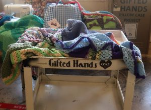 Metal card filled with scarves and hats