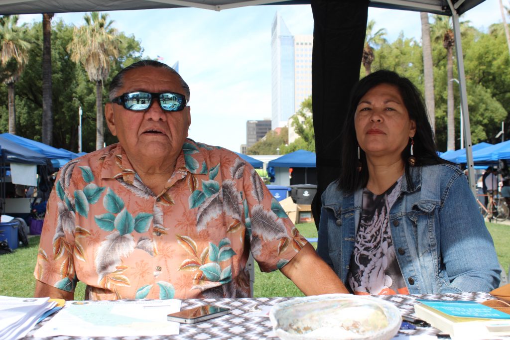 CDCR Native American Spiritual Leader Ted "Bear" Jackson and his wife Gemma sit at a table at the State Capitol.