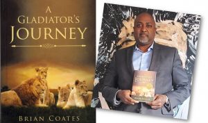 Brian Coates holds a book called A Gladiator's Journey.