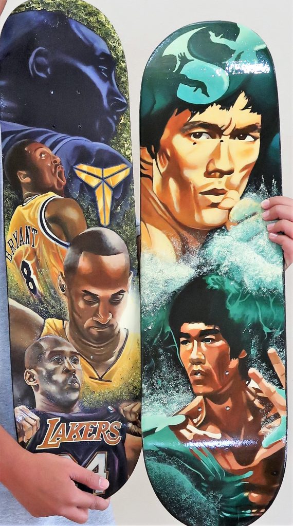 Paintings of Kobe Bryant and Bruce Lee.