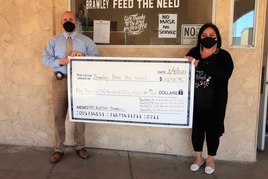 Brawley Feed the Need is presented with a donation check.
