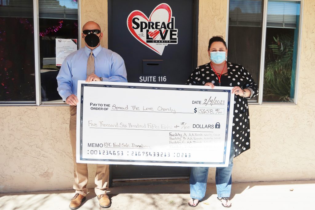 A check for Spread the Love Charity.