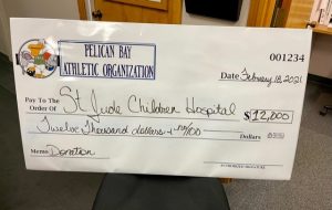Pelican Bay staff presented a check to St. Judge Children's Hospital.