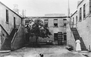 Early female prison staff supervised women at San Quentin, like in this early courtyard image.