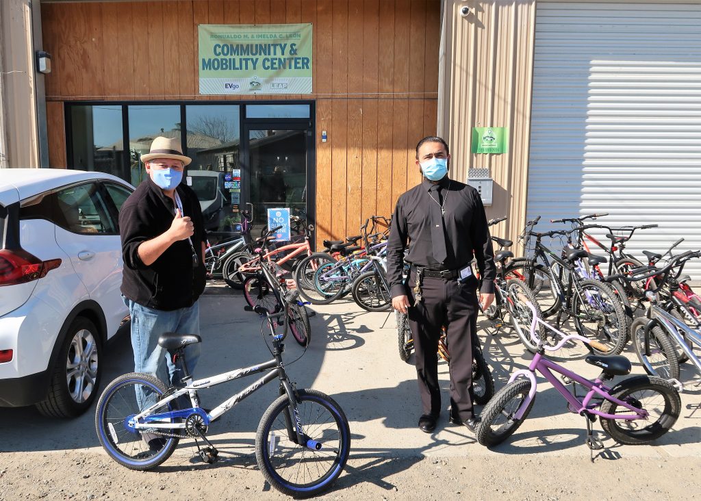 Two men and prison refurbished bicycles in Huron.