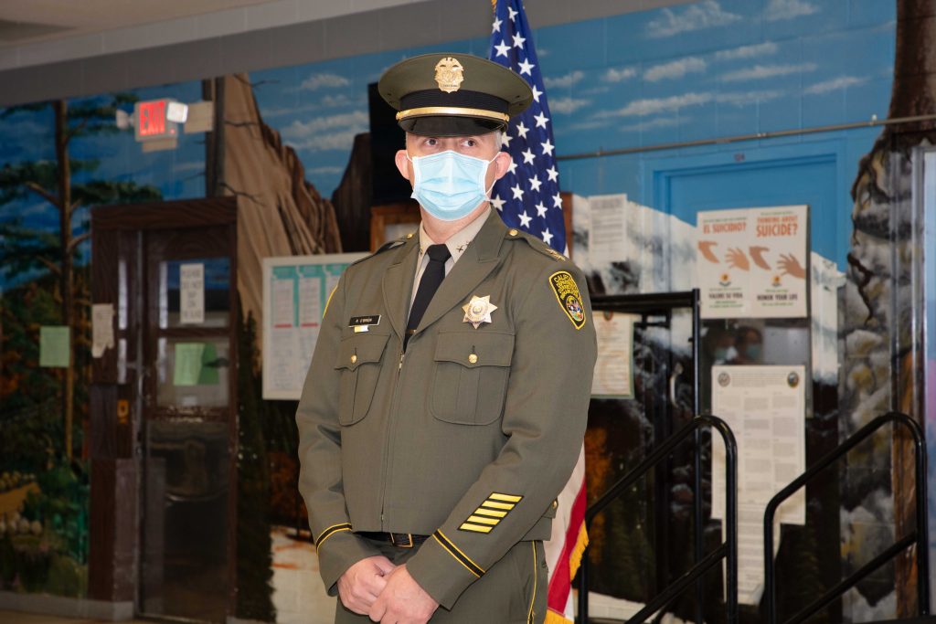 Man wearing uniform and wearing a mask