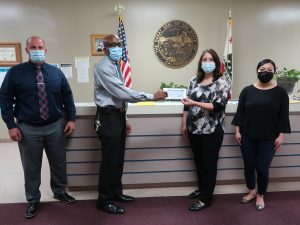 Valley State Prison warden donates check