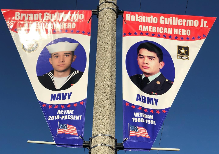 Two military members are shown on flags.